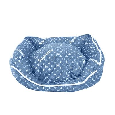 Blue monogram dog bed with white LV pattern and Supreme inspired design