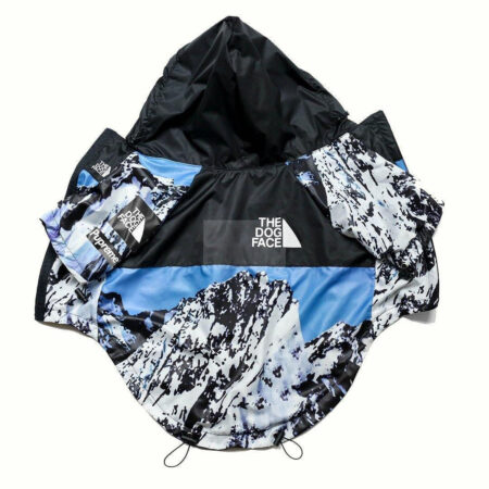 Blue mountain print dog windbreaker with North Face inspired TDF logo flat lay