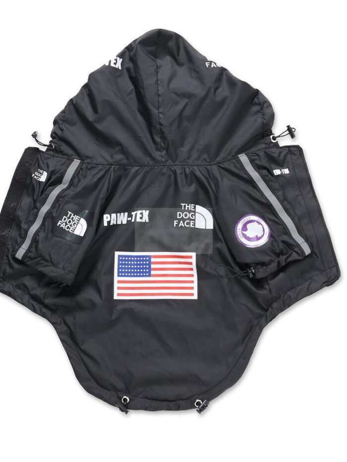 Black technical dog windbreaker Supreme North Face collaboration style with multiple brand patches
