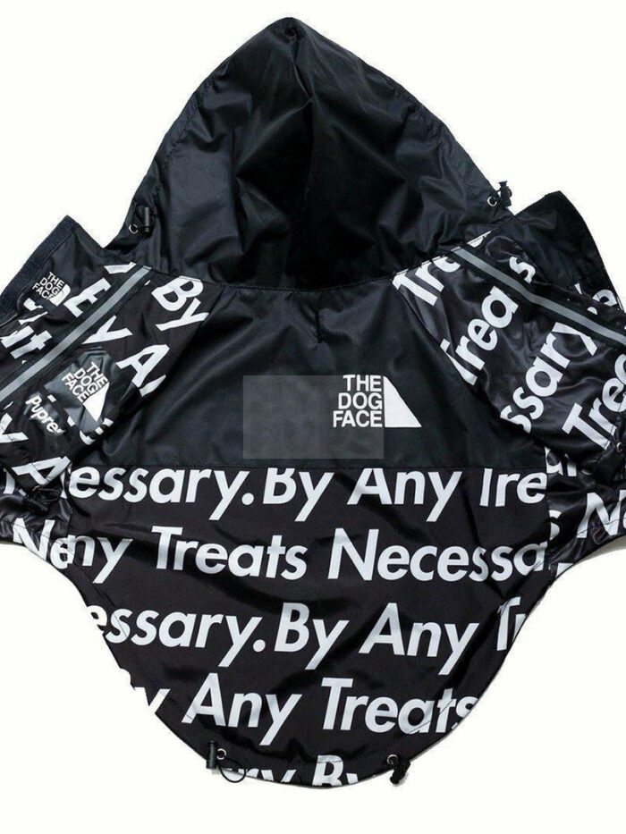 Black TDF windbreaker with repeated text print and triangle logo on chest